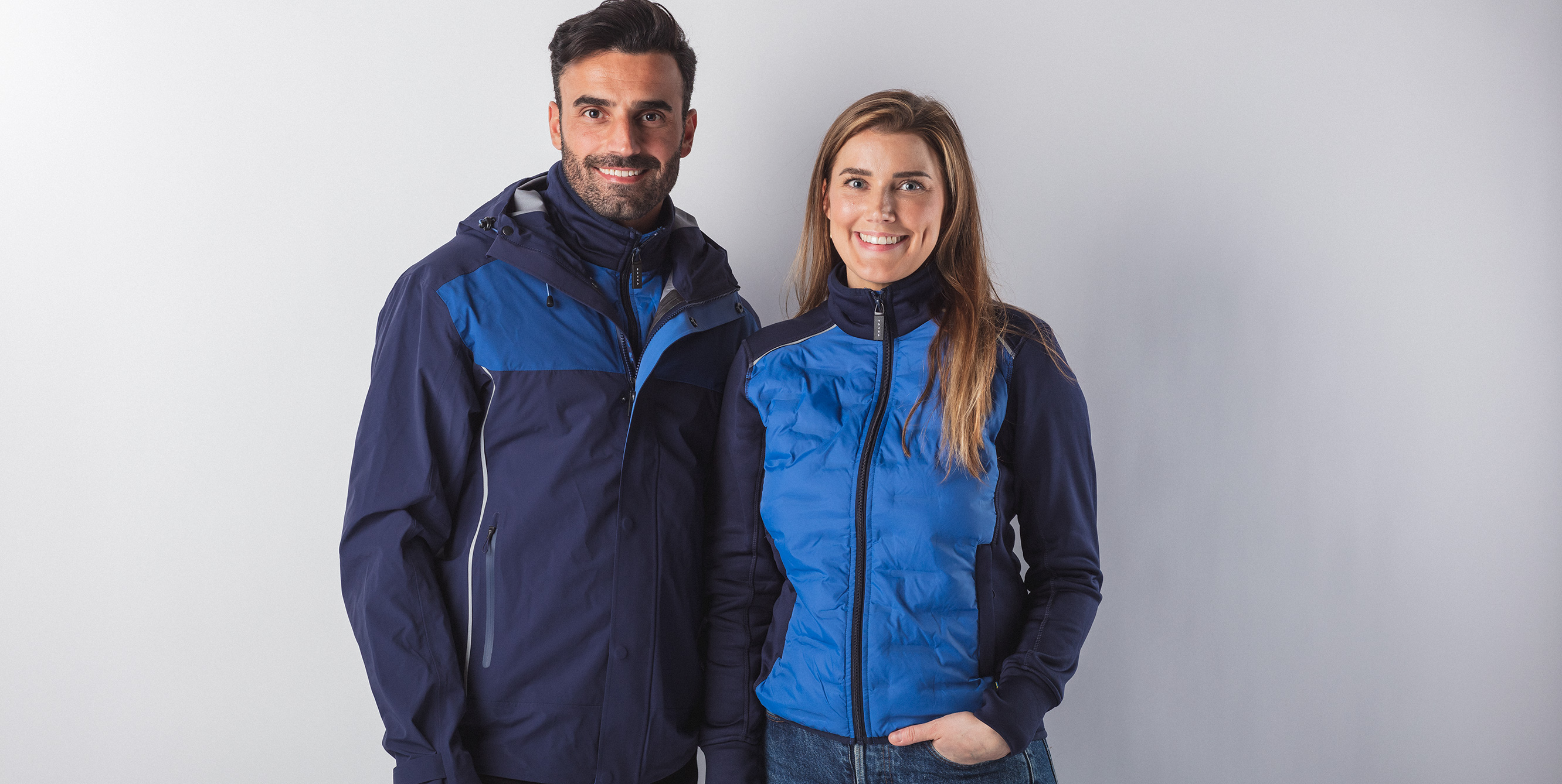 Couple in blue Volvo merchandise jackets