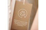 Hang tag showing recycled cotton mix – communicates use of repurposed cotton fibers