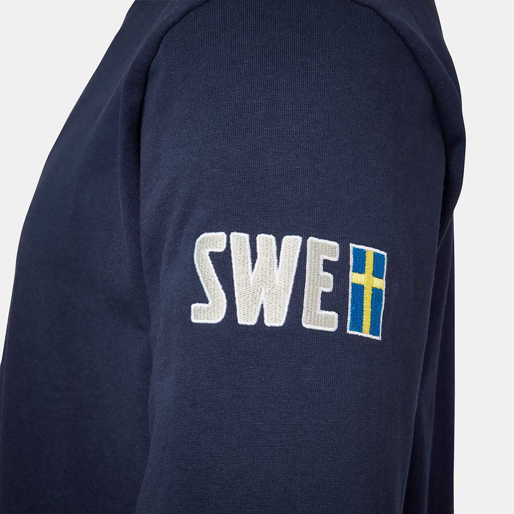 Close up on navy Volvo sweatshirt with SWE and Swedish flag on the sleeve
